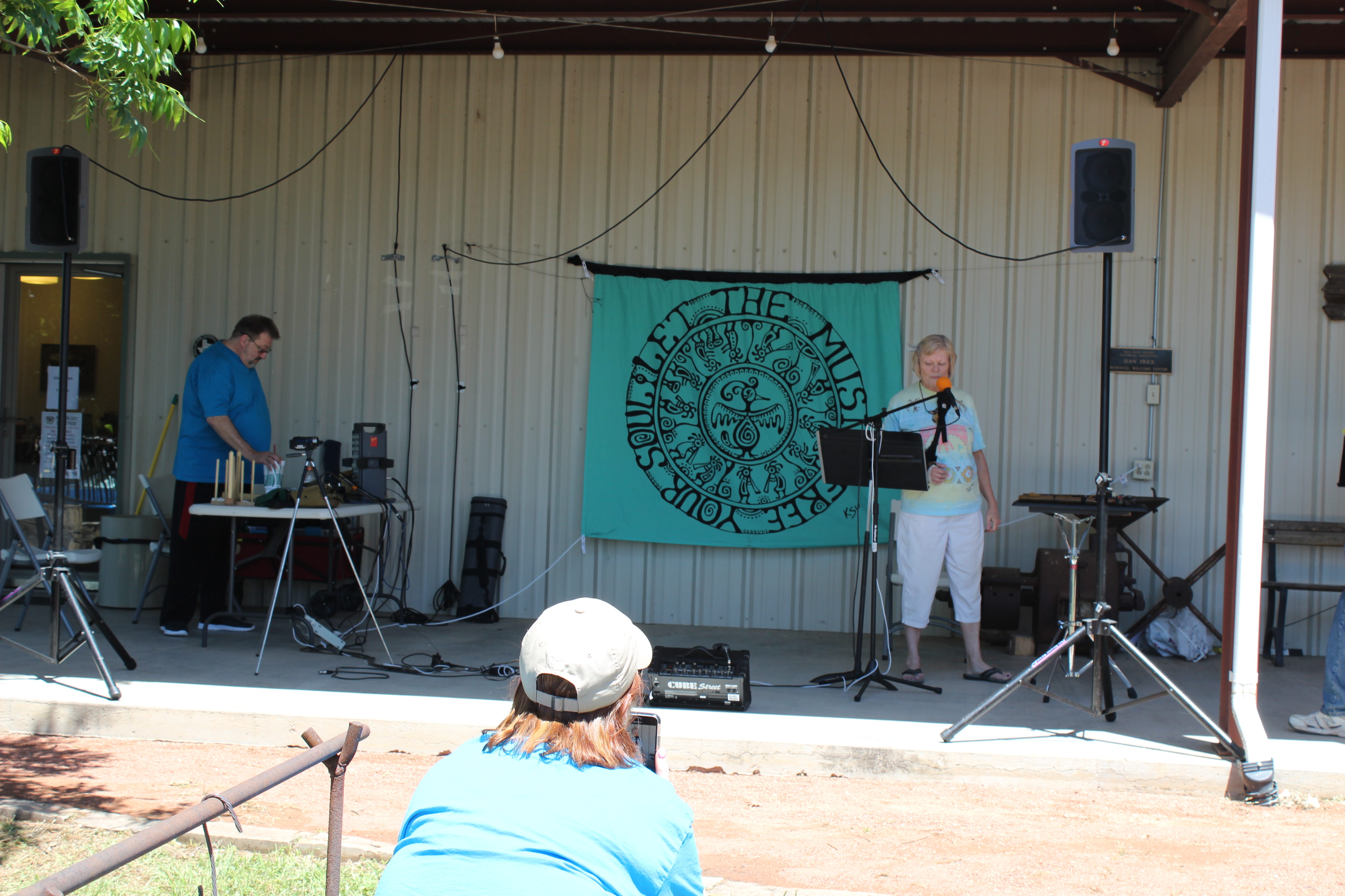 Native American flute musician Sandy Horton recites original poetry.